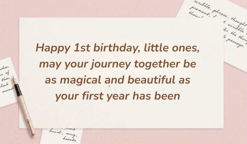 Elegant soft pink stationery setup with a fountain pen showing 1st birthday wishes for twins stating "Happy 1st birthday, little ones, may your journey together be as magical and beautiful as your first year has been"