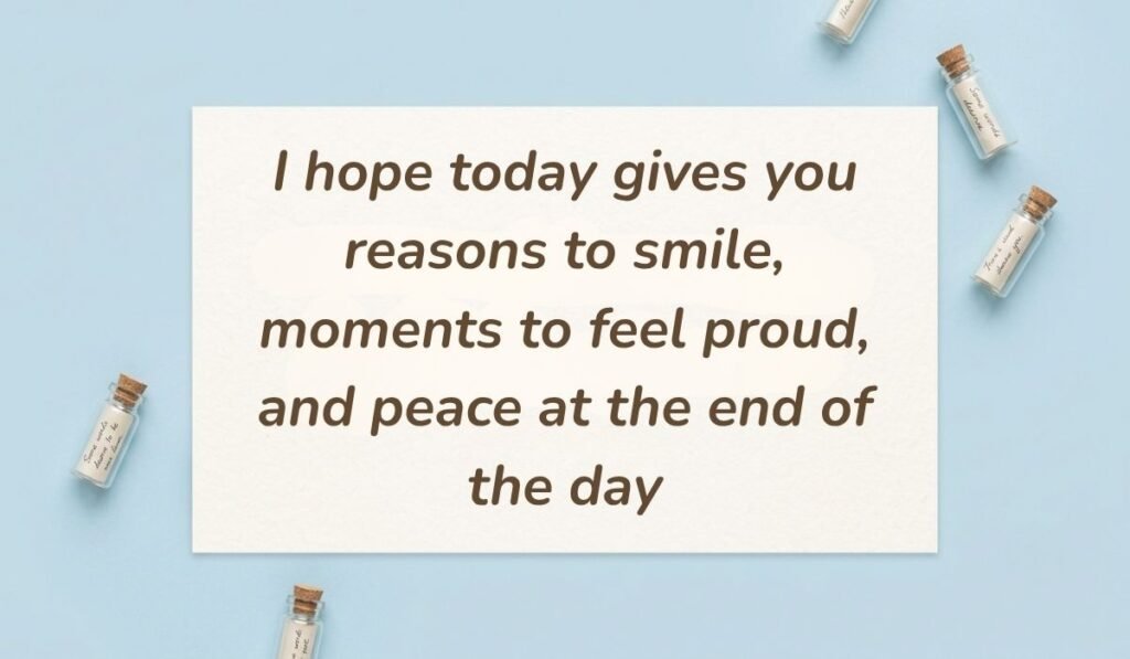 Light blue flat lay with mini glass message bottles showing best morning messages for him reading, "I hope today gives you reasons to smile, moments to feel proud, and peace at the end of the day"