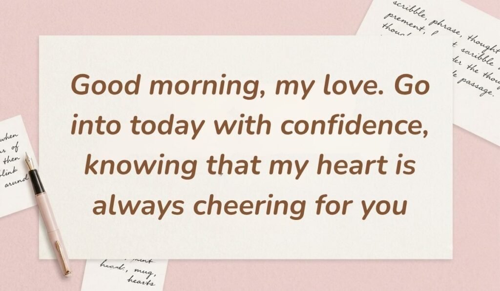 Soft pink background with a fountain pen and handwritten notes featuring best morning messages for him reading, "Good morning, my love. Go into today with confidence, knowing that my heart is always cheering for you"