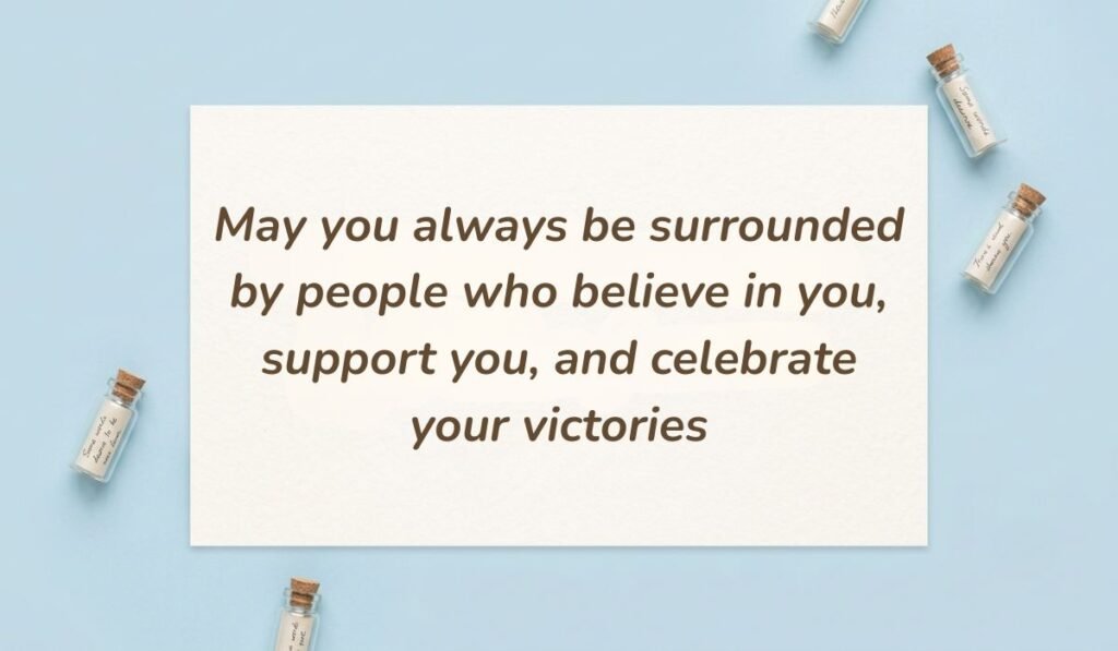Light blue flat lay with mini corked message bottles displaying birthday messages for nephew from aunt stating "May you always be surrounded by people who believe in you, support you, and celebrate your victories"