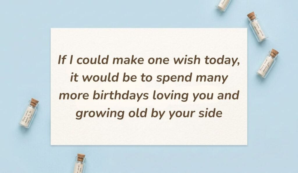 Light blue flat lay with mini corked message bottles displaying birthday quotes for husband birthday stating "If I could make one wish today, it would be to spend many more birthdays loving you and growing old by your side"