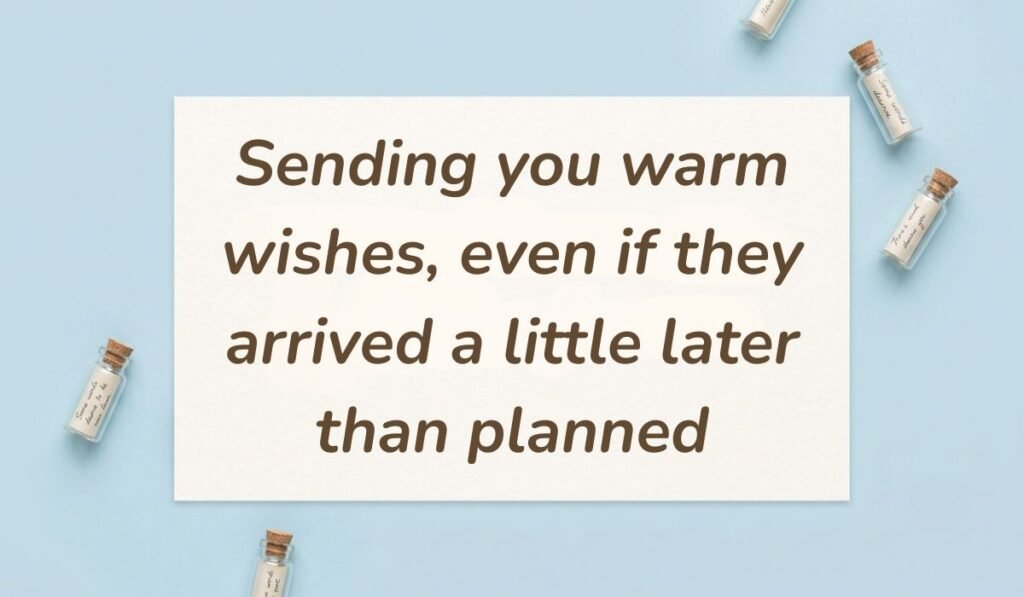 Light blue flat lay with mini glass message bottles showing birthday wishes for belated birthday reading, "Sending you warm wishes, even if they arrived a little later than planned"