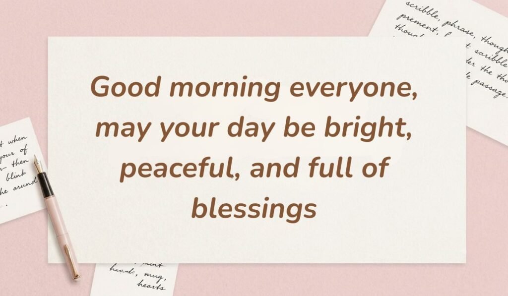 Pink stationery desk scene with a fountain pen displaying good morning messages for friends reading "Good morning everyone, may your day be bright, peaceful, and full of blessings."