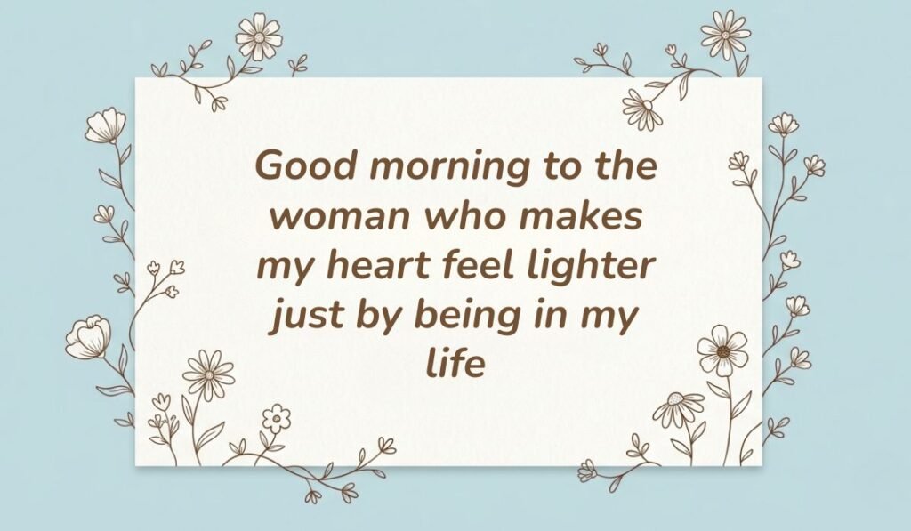 Good morning messages for her displayed on a soft blue floral card reading "Good morning to the woman who makes my heart feel lighter just by being in my life."