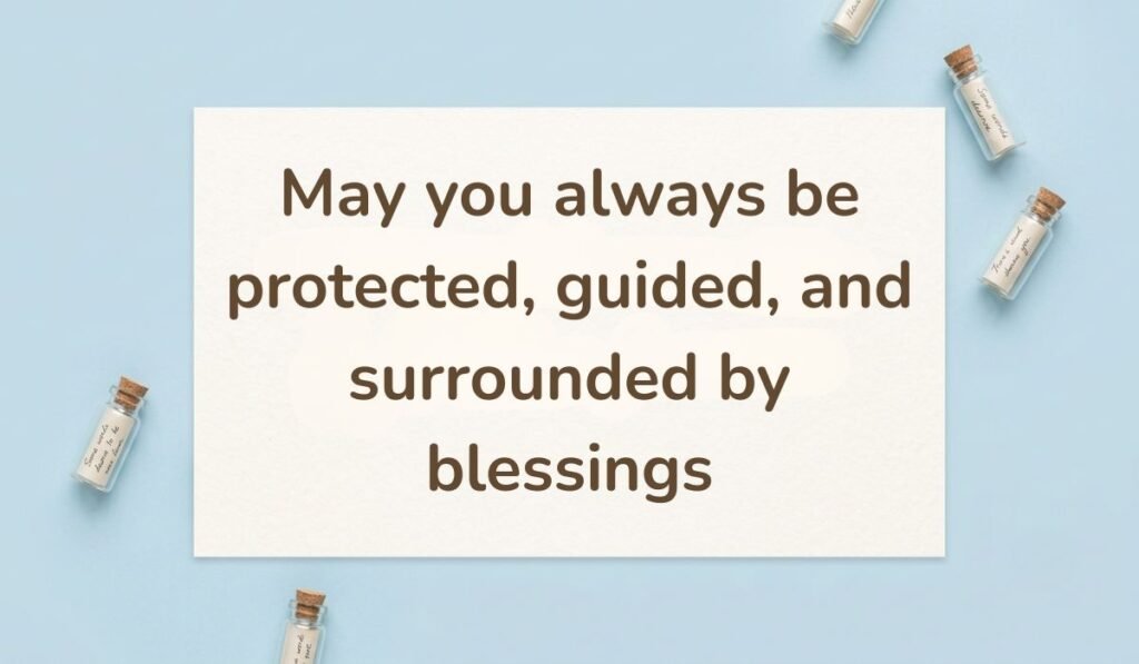 Clean light blue background styled with small glass wish bottles, highlighting a prayerful happy new month message to my wife: "May you always be protected, guided, and surrounded by blessings".