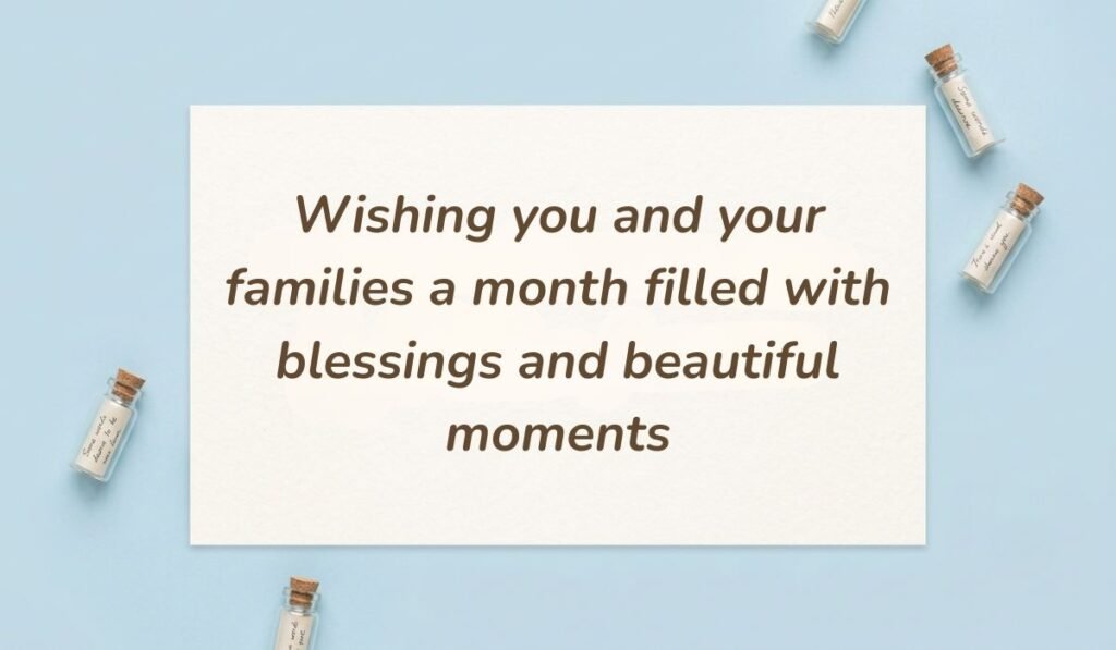 Light blue flatlay with miniature glass bottles displaying happy new month messages for colleagues stating "Wishing you and your families a month filled with blessings and beautiful moments."