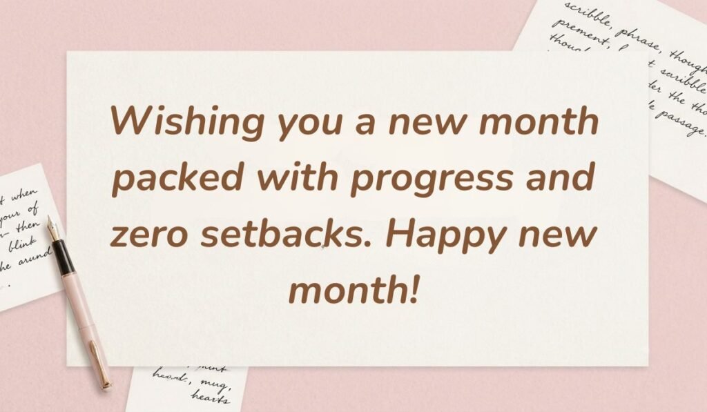 Pink desk setting with a fountain pen showcasing happy new month messages to clients reading "Wishing you a new month packed with progress and zero setbacks. Happy new month!"