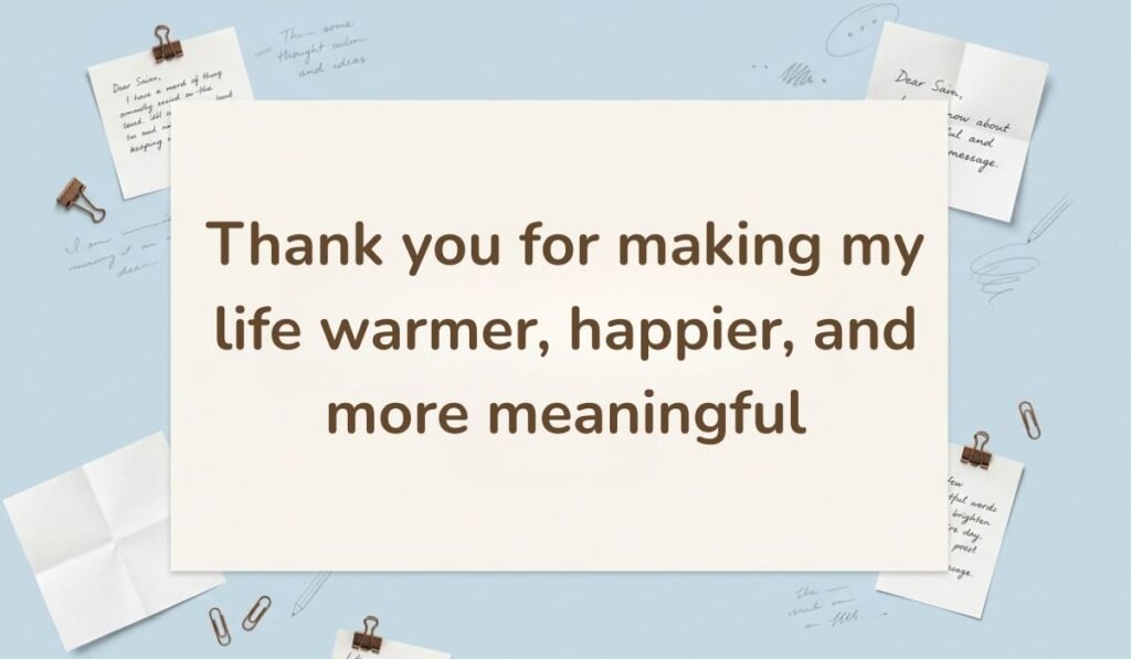 Light blue background accented with paper clips and handwritten sticky notes, displaying a heartfelt happy new month message to my fiance: "Thank you for making my life warmer, happier, and more meaningful".