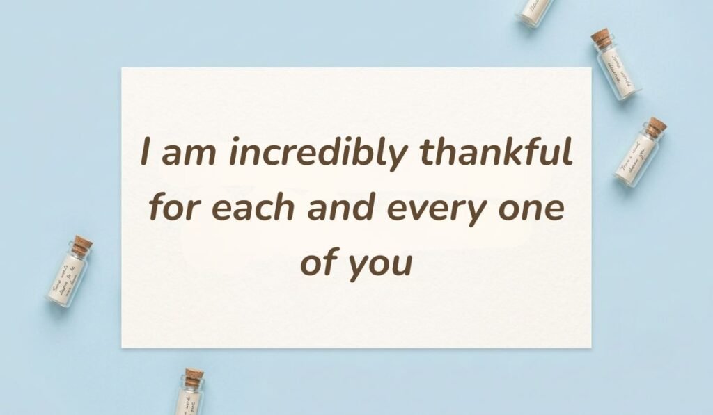 Light blue flat lay with mini glass message bottles showing a thank you message for all the birthday wishes reading, "Wishing you a 50th birthday filled with love, laughter, gratitude, and unforgettable memories"