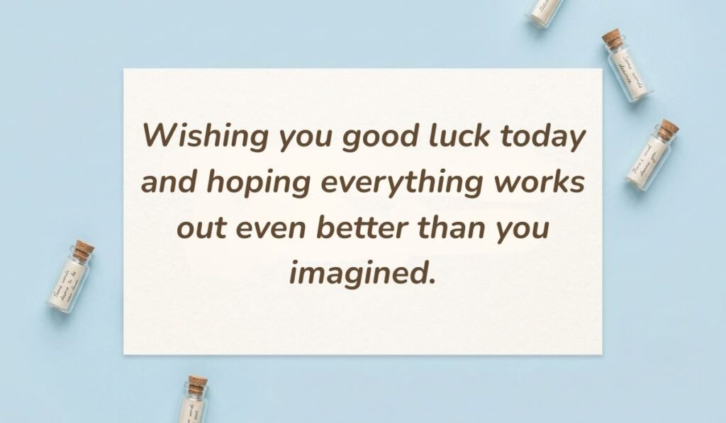 Powder blue flat lay with mini glass message bottles showcasing one of the best quotes for good luck reading, "Wishing you good luck today and hoping everything works out even better than you imagined."