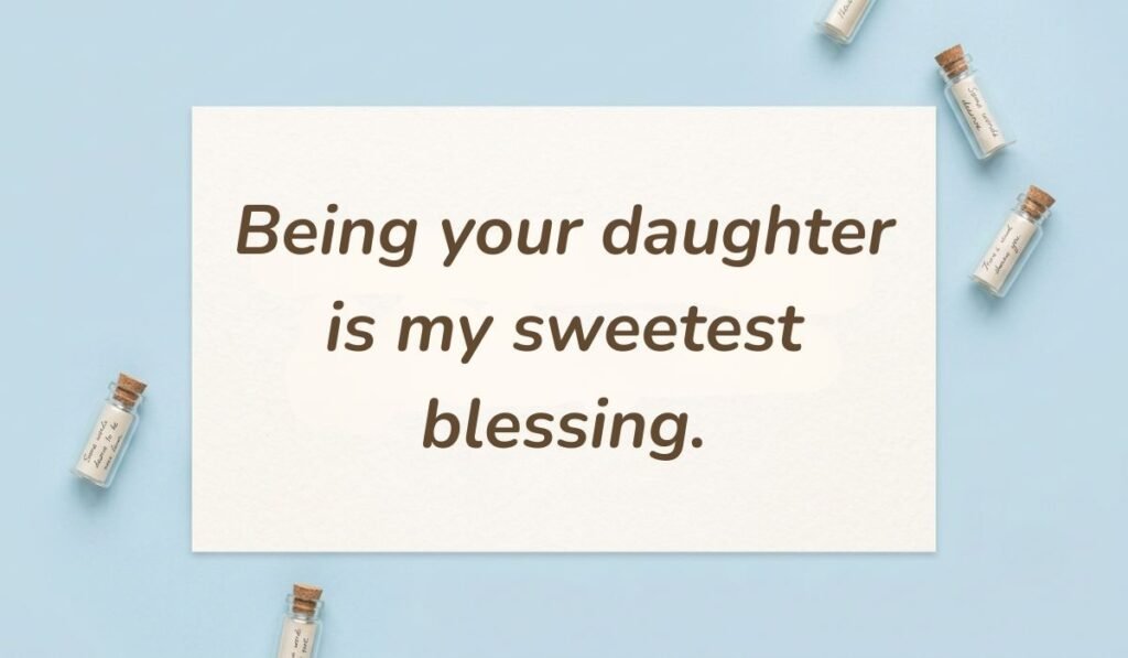 Light blue flat lay with mini glass message bottles showing daughter quotes for mothers day reading, "Being your daughter is my sweetest blessing."