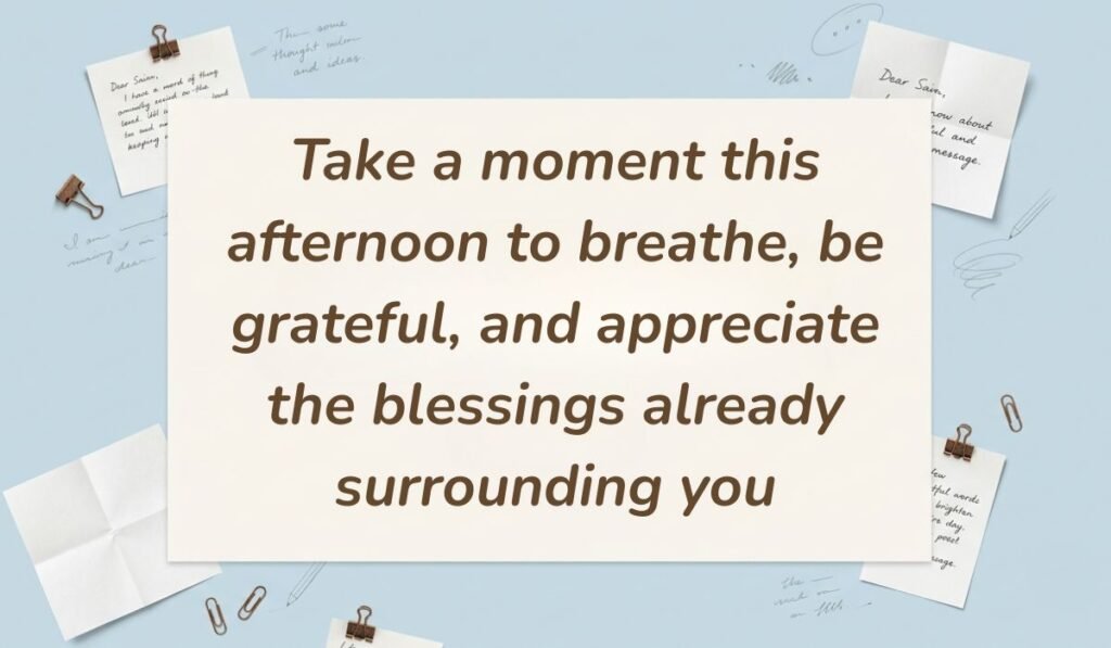Light blue workspace setting surrounded by paperclips and note cards featuring good afternoon blessings stating, "Take a moment this afternoon to breathe, be grateful, and appreciate the blessings already surrounding you"