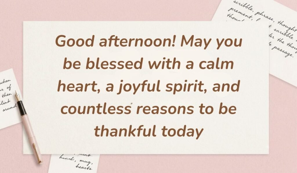 Soft pink desk layout with a fountain pen and handwritten stationery cards showcasing good afternoon blessings stating, "Good afternoon! May you be blessed with a calm heart, a joyful spirit, and countless reasons to be thankful today"