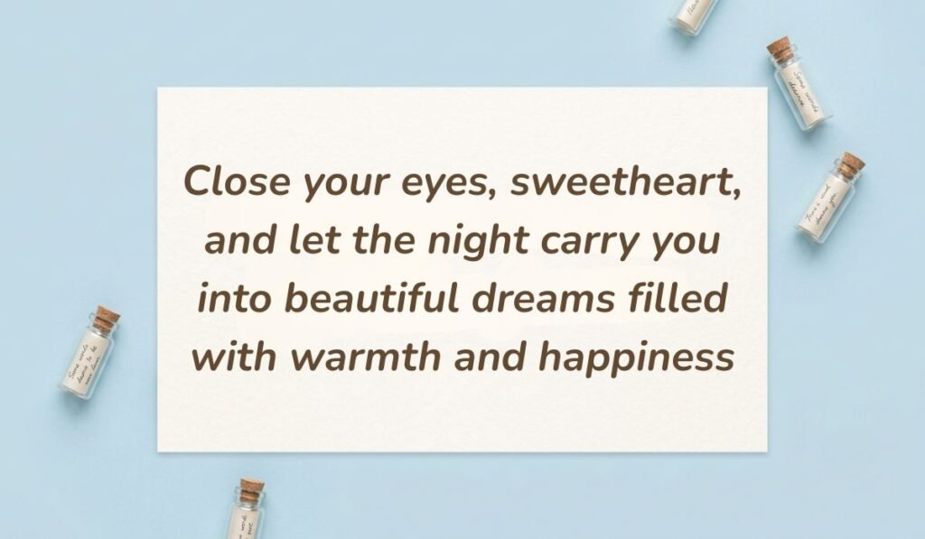 Light blue flat lay with mini glass message bottles showing good night text messages for her reading, "Close your eyes, sweetheart, and let the night carry you into beautiful dreams filled with warmth and happiness"