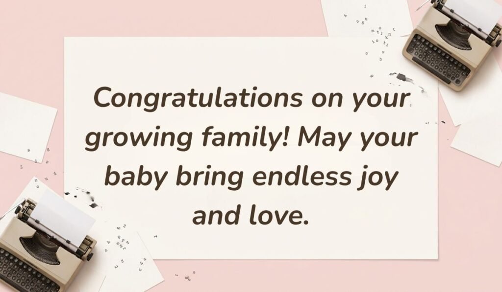 Soft pink background with vintage typewriters featuring messages for baby shower card reading, "Congratulations on your growing family! May your baby bring endless joy and love."