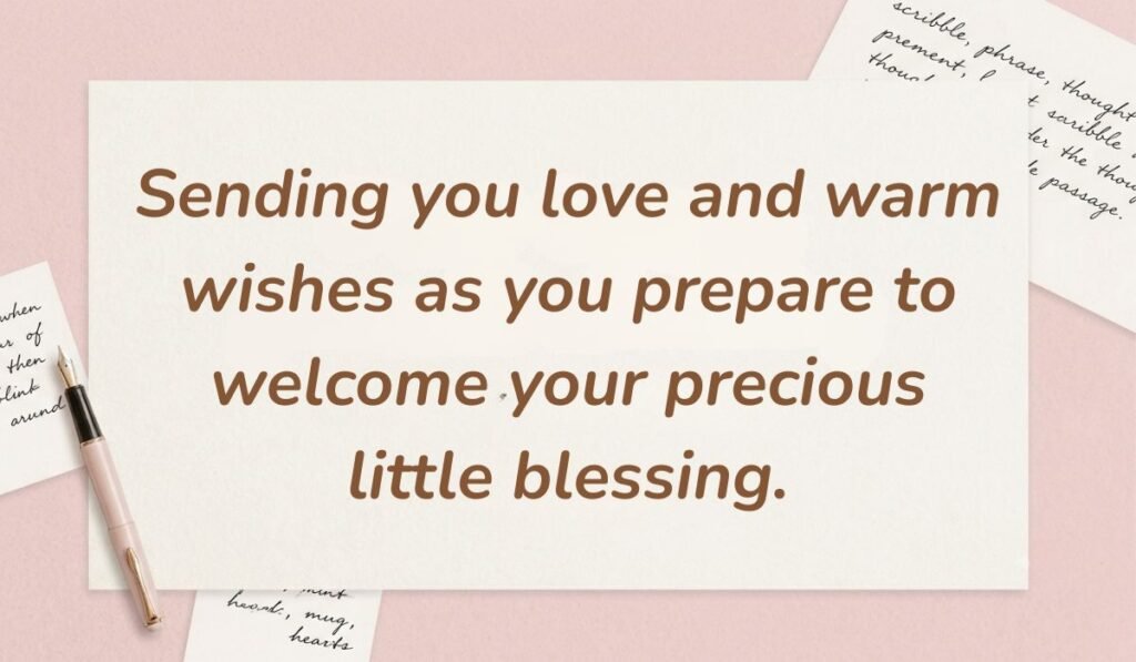 Soft pink desk background with a fountain pen and handwritten notes displaying messages for baby shower card reading, "Sending you love and warm wishes as you prepare to welcome your precious little blessing."