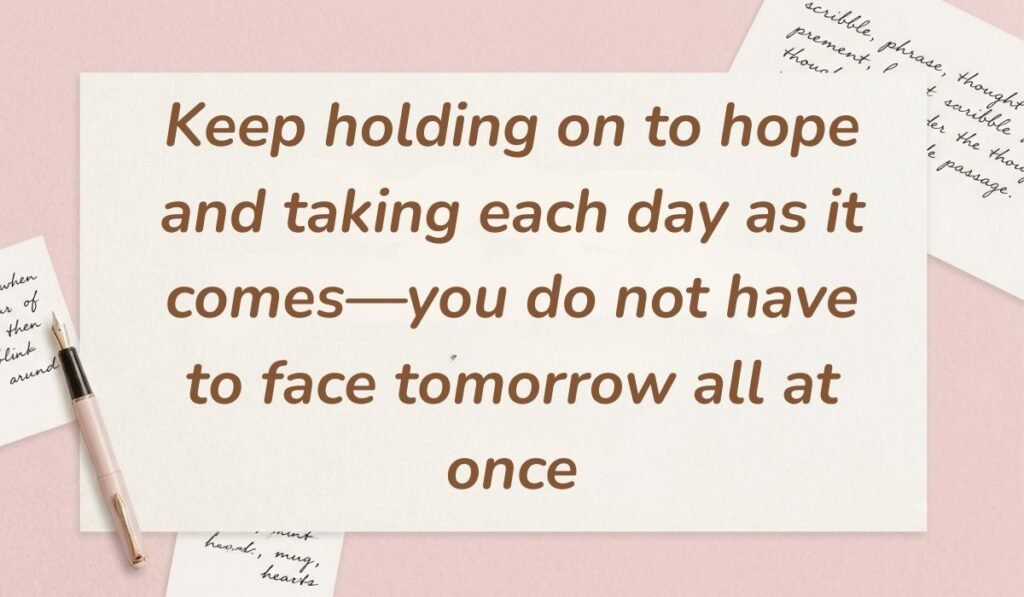 Soft pink desktop layout with handwritten script scraps and a sleek fountain pen displaying motivational quotes for cancer patients reading, "Keep holding on to hope and taking each day as it comes—you do not have to face tomorrow all at once."
