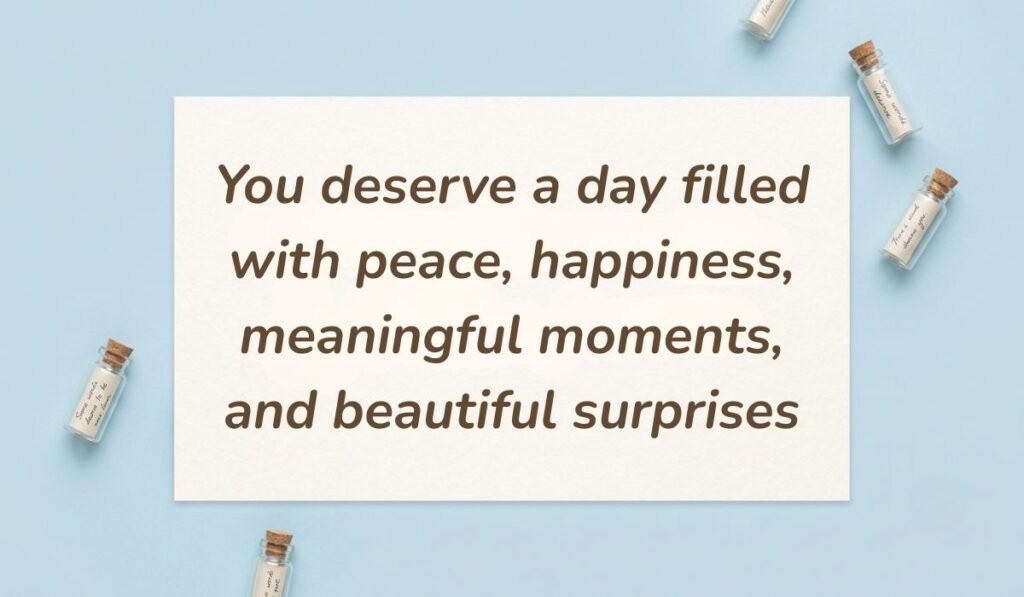 Light blue surface accented with miniature glass message bottles displaying positive messages for the day reading, "You deserve a day filled with peace, happiness, meaningful moments, and beautiful surprises."