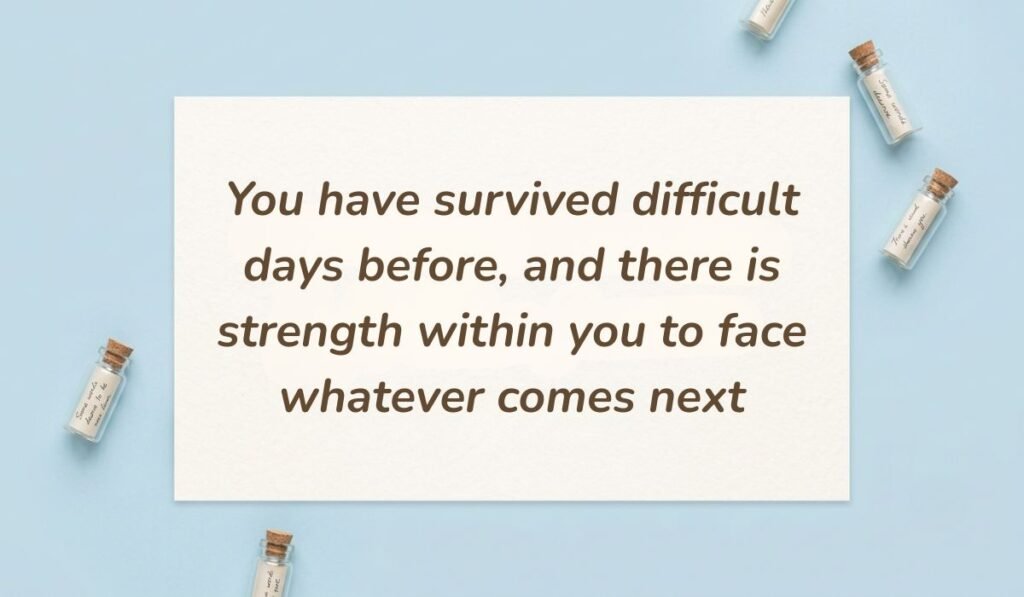 Light blue surface surrounded by mini corked glass message bottles highlighting positive quotes for mental health with text reading, "You have survived difficult days before, and there is strength within you to face whatever comes next."