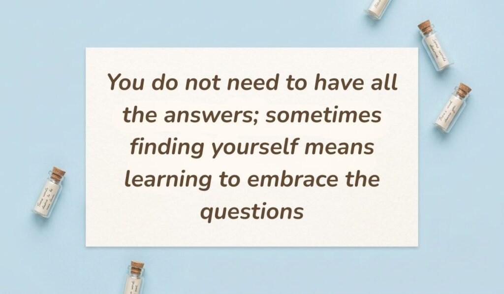 Light blue surface surrounded by mini corked glass message bottles showing quotes about searching for yourself stating, "You do not need to have all the answers; sometimes finding yourself means learning to embrace the questions."