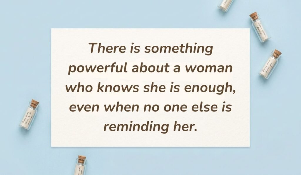 Light blue flat lay with mini glass message bottles showing self love quotes for women reading, "There is something powerful about a woman who knows she is enough, even when no one else is reminding her."