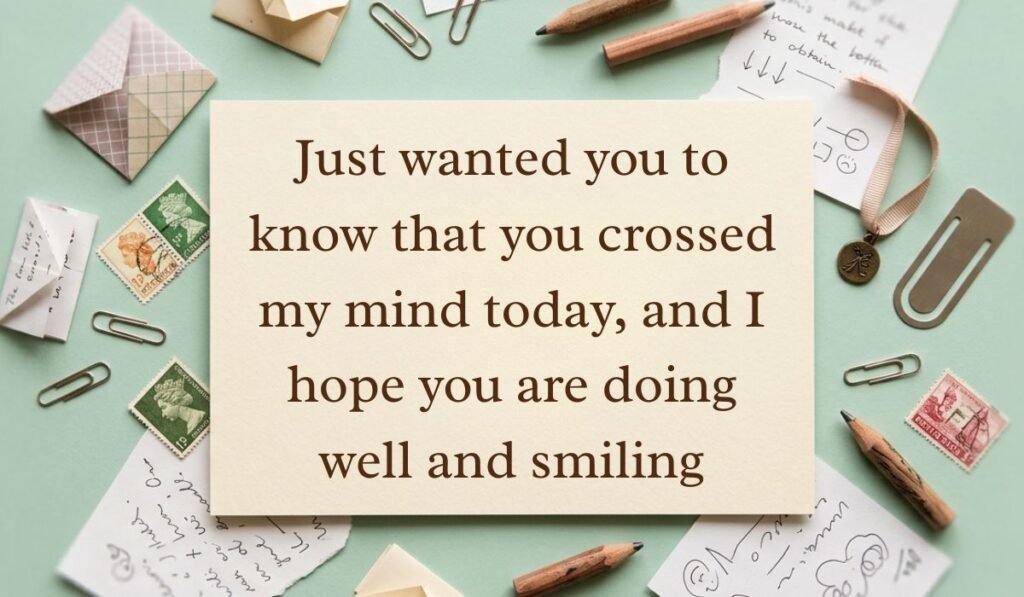 Soft mint green vintage desk layout with scattered postage stamps, envelopes, and pencils featuring thinking of you messages reading, "Just wanted you to know that you crossed my mind today, and I hope you are doing well and smiling"