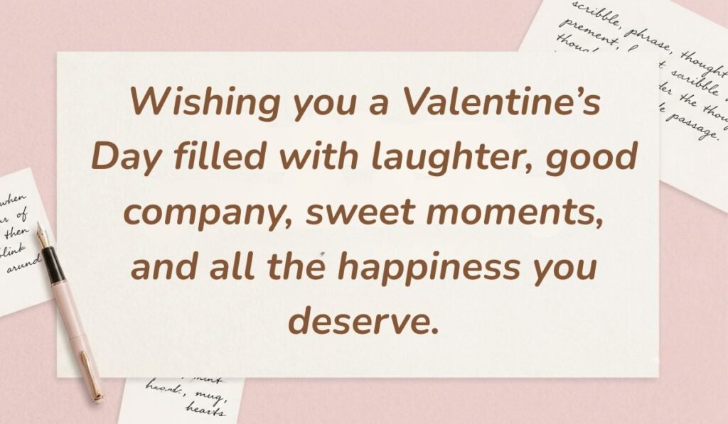 Soft pink desk background with a fountain pen and handwritten notes displaying valentine's day quotes for friends reading, "Wishing you a Valentine’s Day filled with laughter, good company, sweet moments, and all the happiness you deserve."