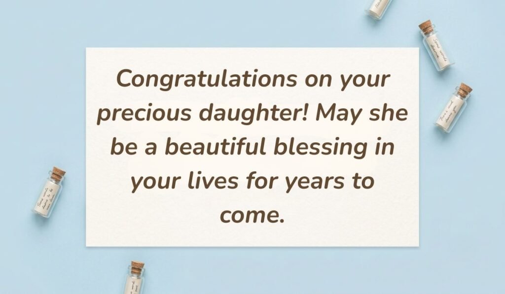 Light blue flat lay with mini glass message bottles showing wishes for new born baby girl reading, "Congratulations on your precious daughter! May she be a beautiful blessing in your lives for years to come."