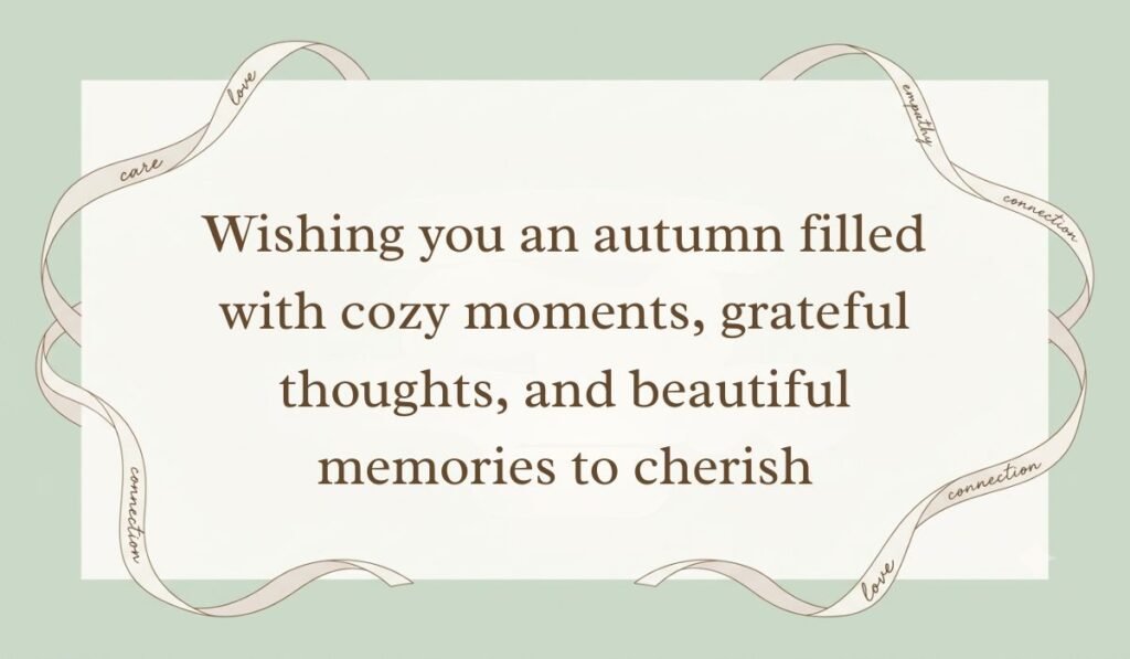 Sage green surface with a white card framed by a decorative flowing ribbon presenting fall blessings quotes reading, "Wishing you an autumn filled with cozy moments, grateful thoughts, and beautiful memories to cherish"