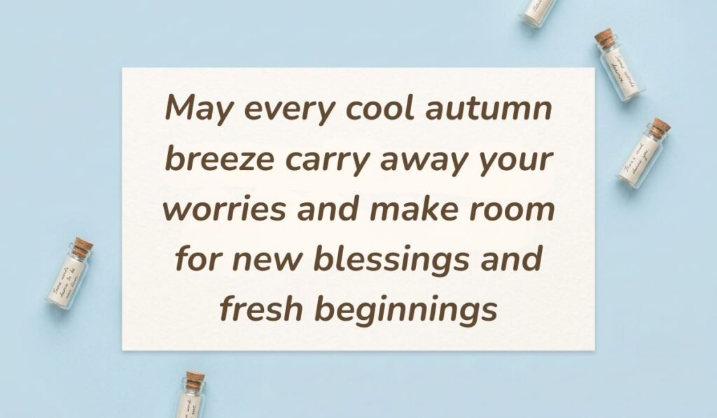 Light sky blue surface arranged with miniature glass message bottles displaying fall blessings quotes reading, "May every cool autumn breeze carry away your worries and make room for new blessings and fresh beginnings"