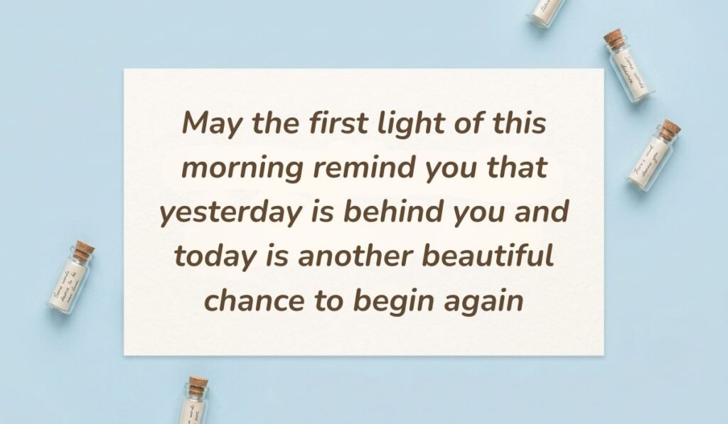 Soft sky blue surface decorated with tiny glass message bottles featuring good morning blessings reading, "May the first light of this morning remind you that yesterday is behind you and today is another beautiful chance to begin again"