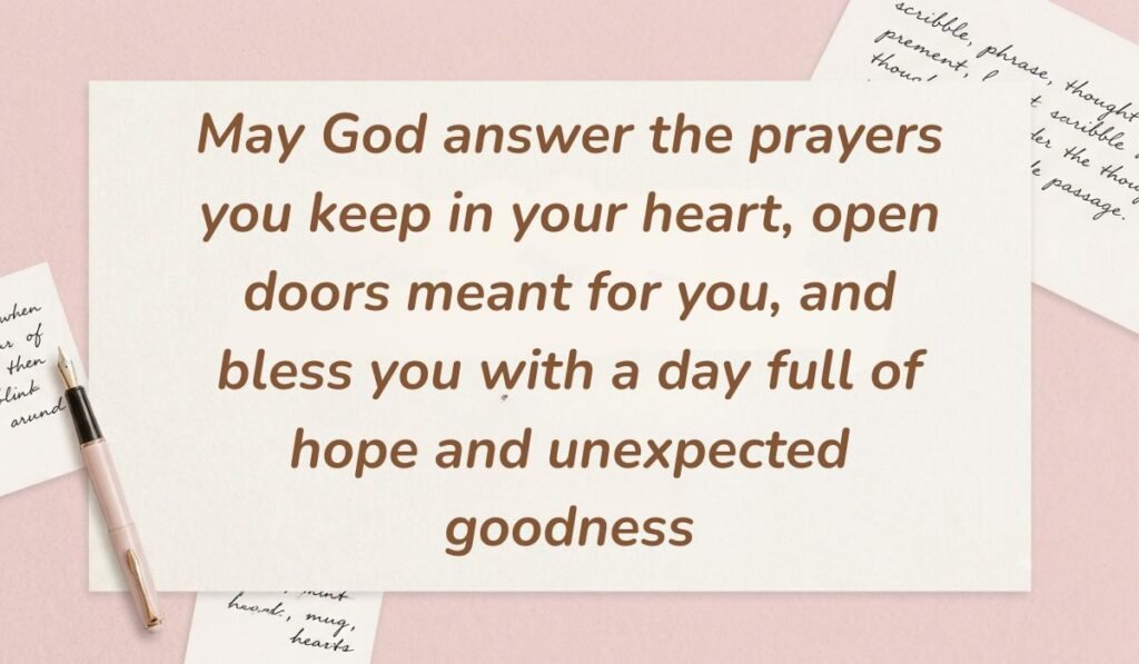Soft pink background decorated with handwritten notes and a fountain pen displaying good morning blessings stating, "May God answer the prayers you keep in your heart, open doors meant for you, and bless you with a day full of hope and unexpected goodness"