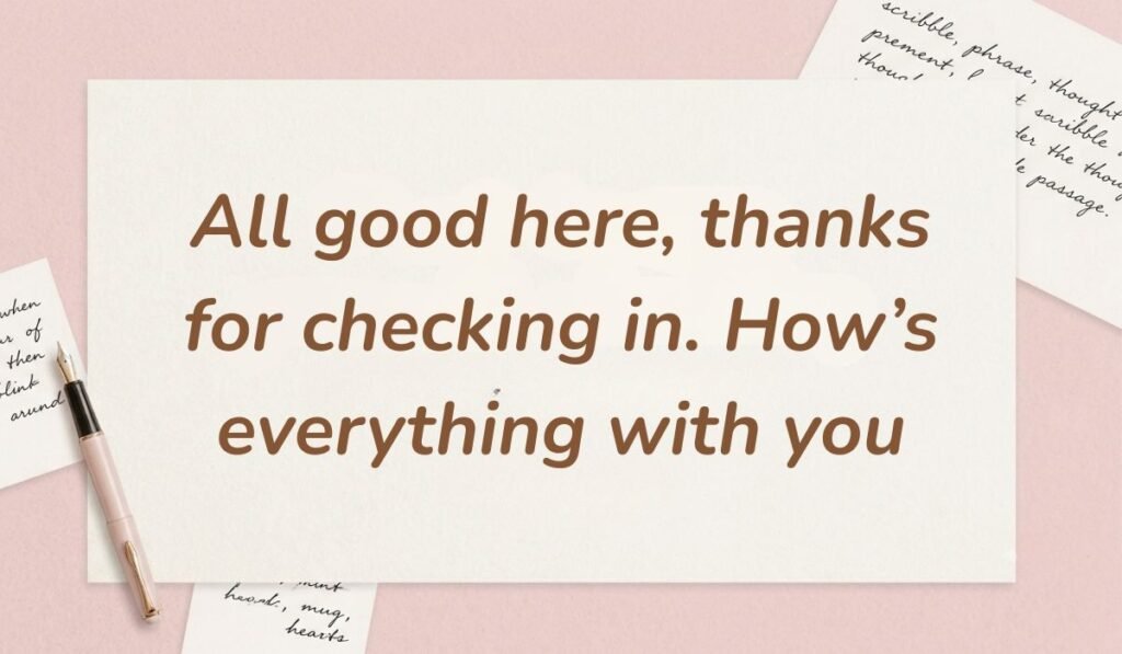 Soft pink desk layout with a fountain pen and handwritten stationery cards showcasing how to reply to how's it going stating, "All good here, thanks for checking in. How's everything with you"